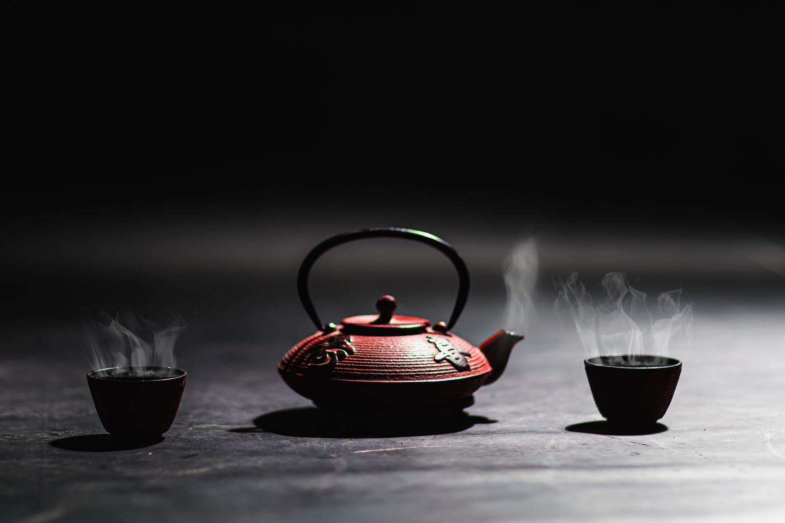 Traditional Chinese teapot and tea cups in a calm wellness setting